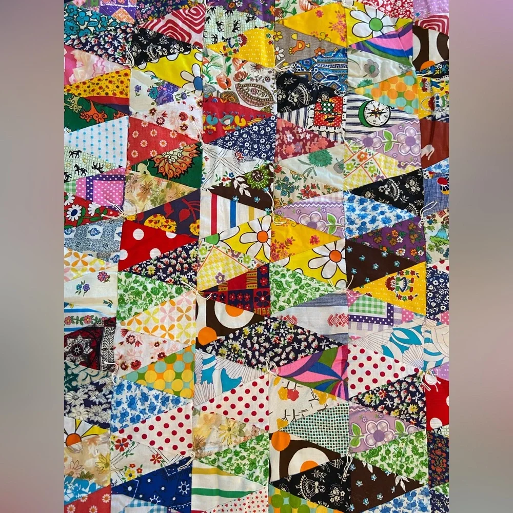 Vintage hand made quilt triangular fabric with solid reverse side